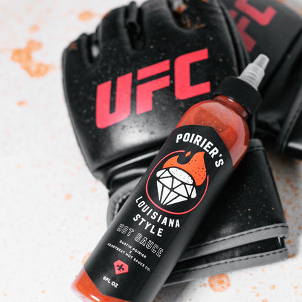 A UFC Glove with Dustin Poirier's Louisiana Style Hot Sauce