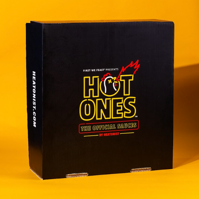 Black box with 'Hot Ones' branding on a yellow background